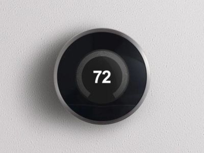 Smart thermostat displaying temperature setting of 72 degrees, illustrating energy-efficient climate control for homeowners.